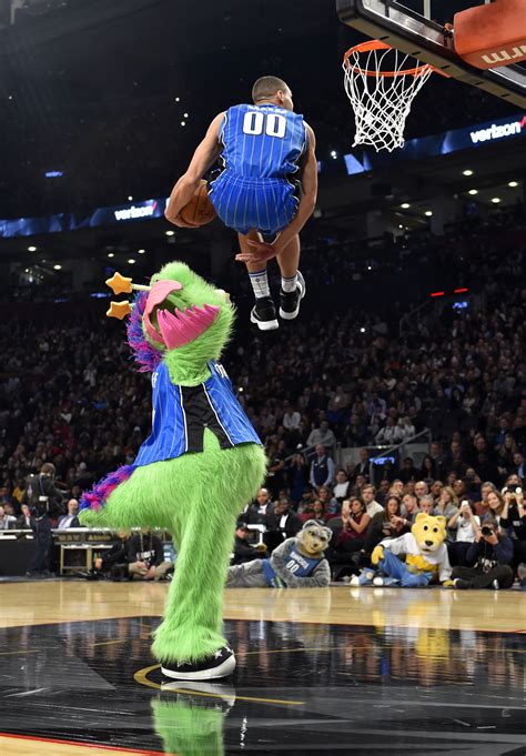 Aaron gordon throws down a dunk over the mascot